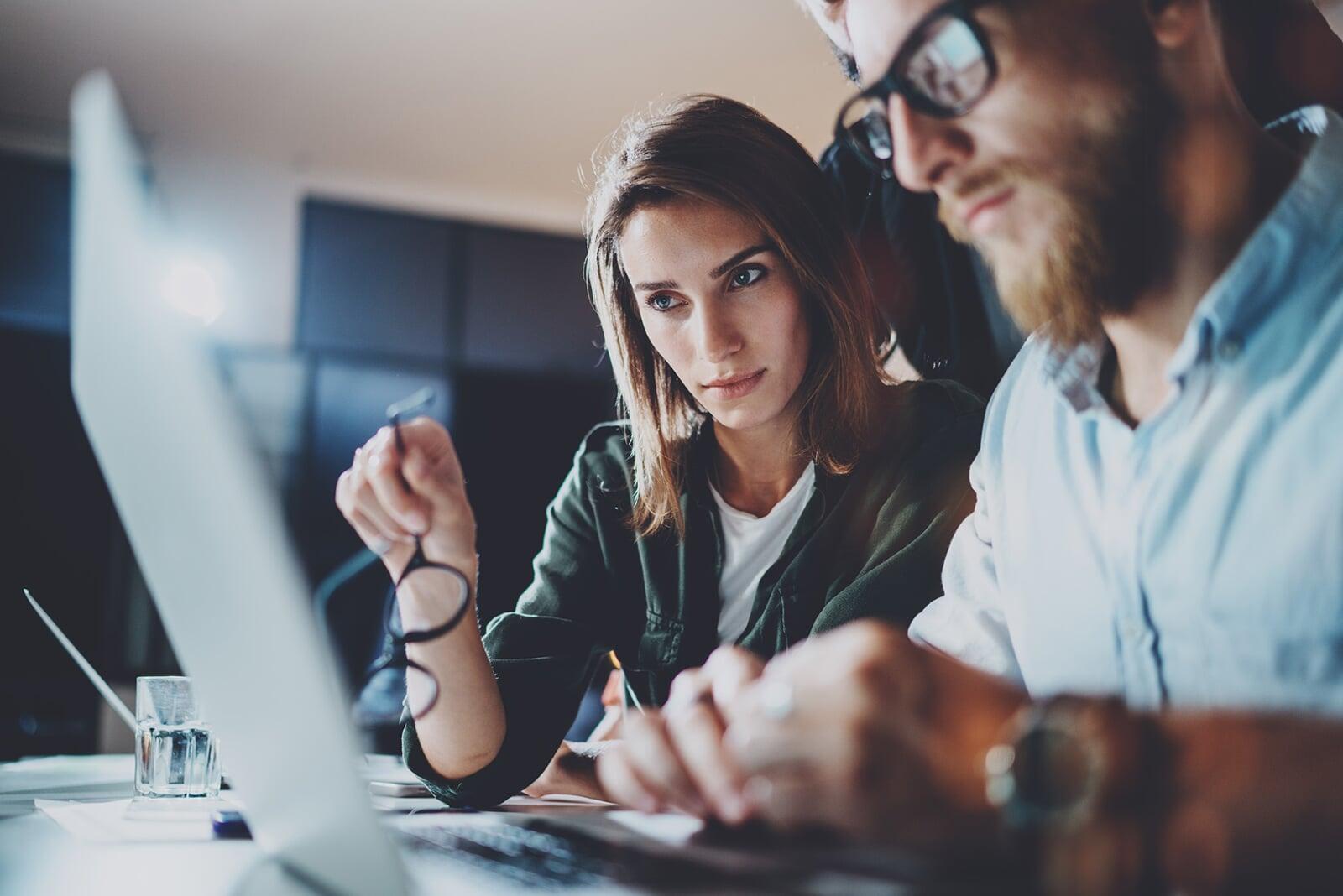 Two people working at a computer