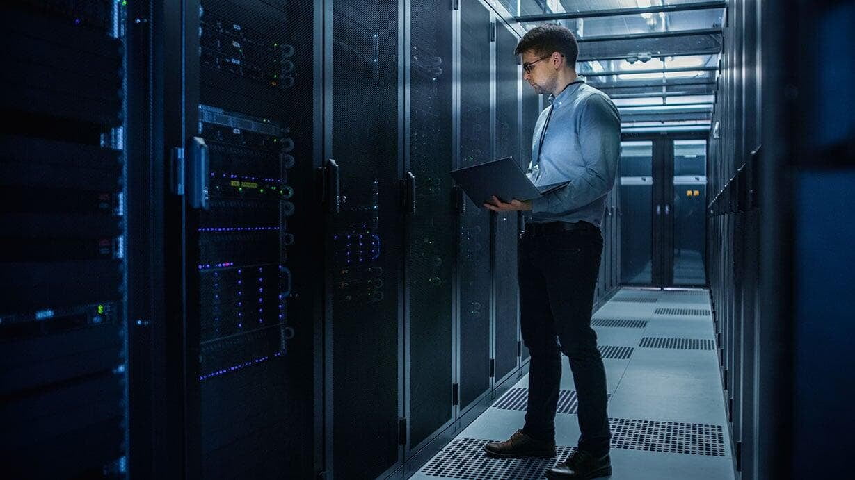 Technician working in a server room